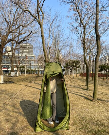 Outdoor green pop-up privacy tent for camping and changing clothes
